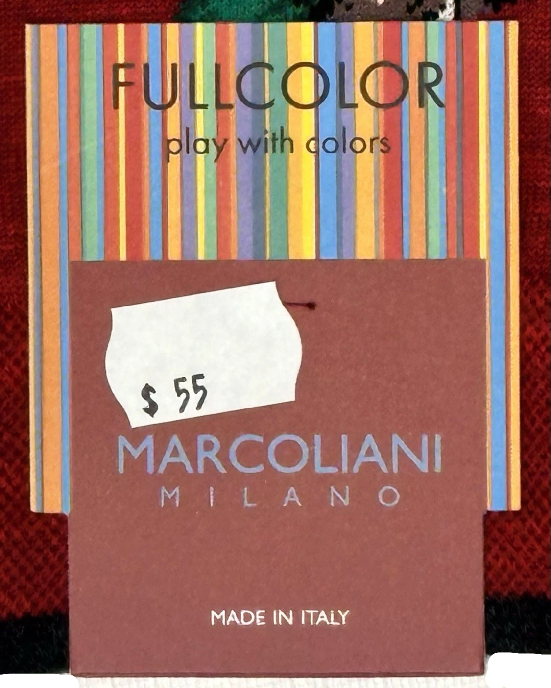 Marcoliani Milano product packaging with colorful striped background