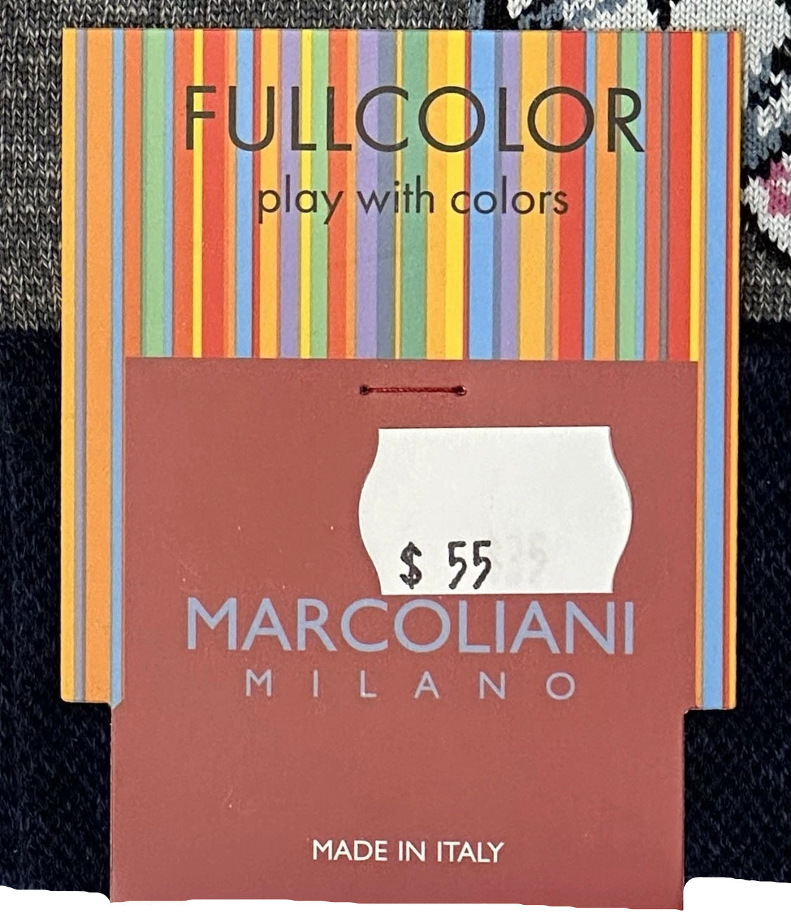 Marcoliani Milano product packaging with colorful stripes and price tag.
